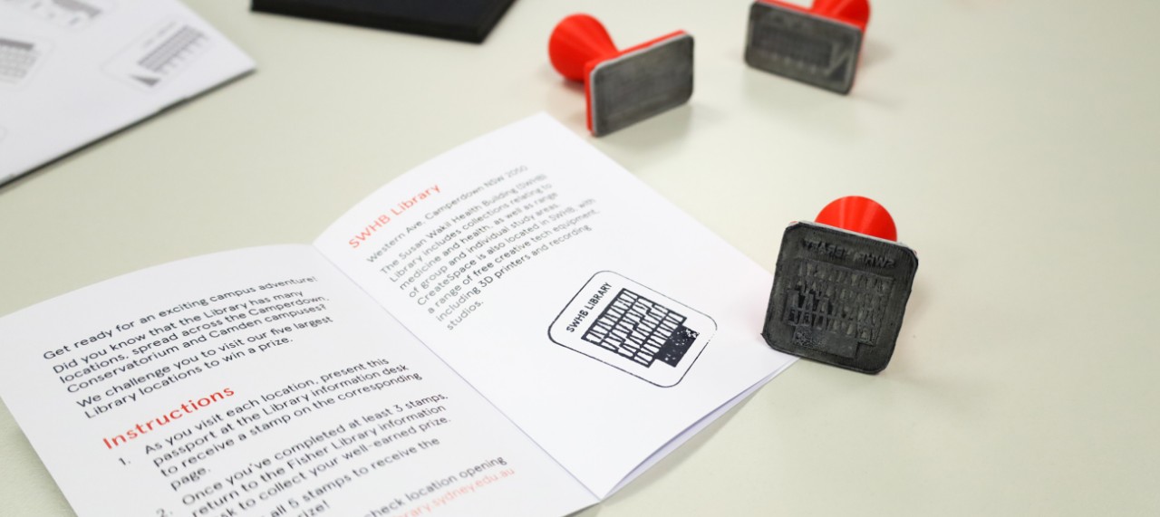 Overhead shot of paper booklets and stamp pad 