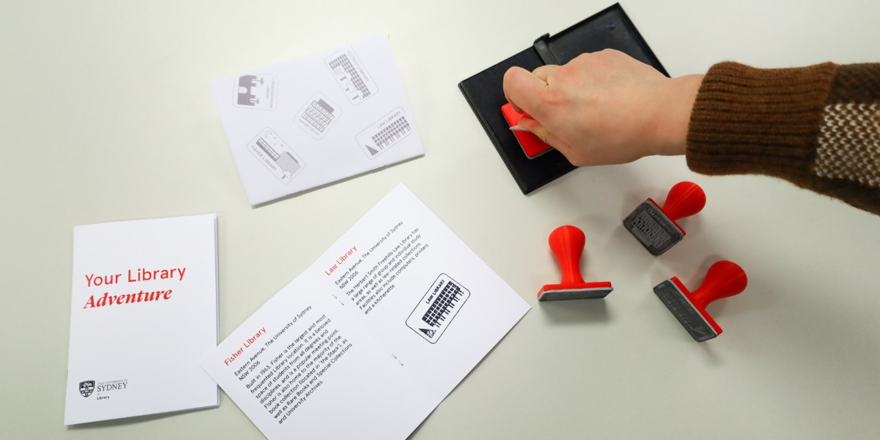 Overhead shot of paper booklets and stamp pad 