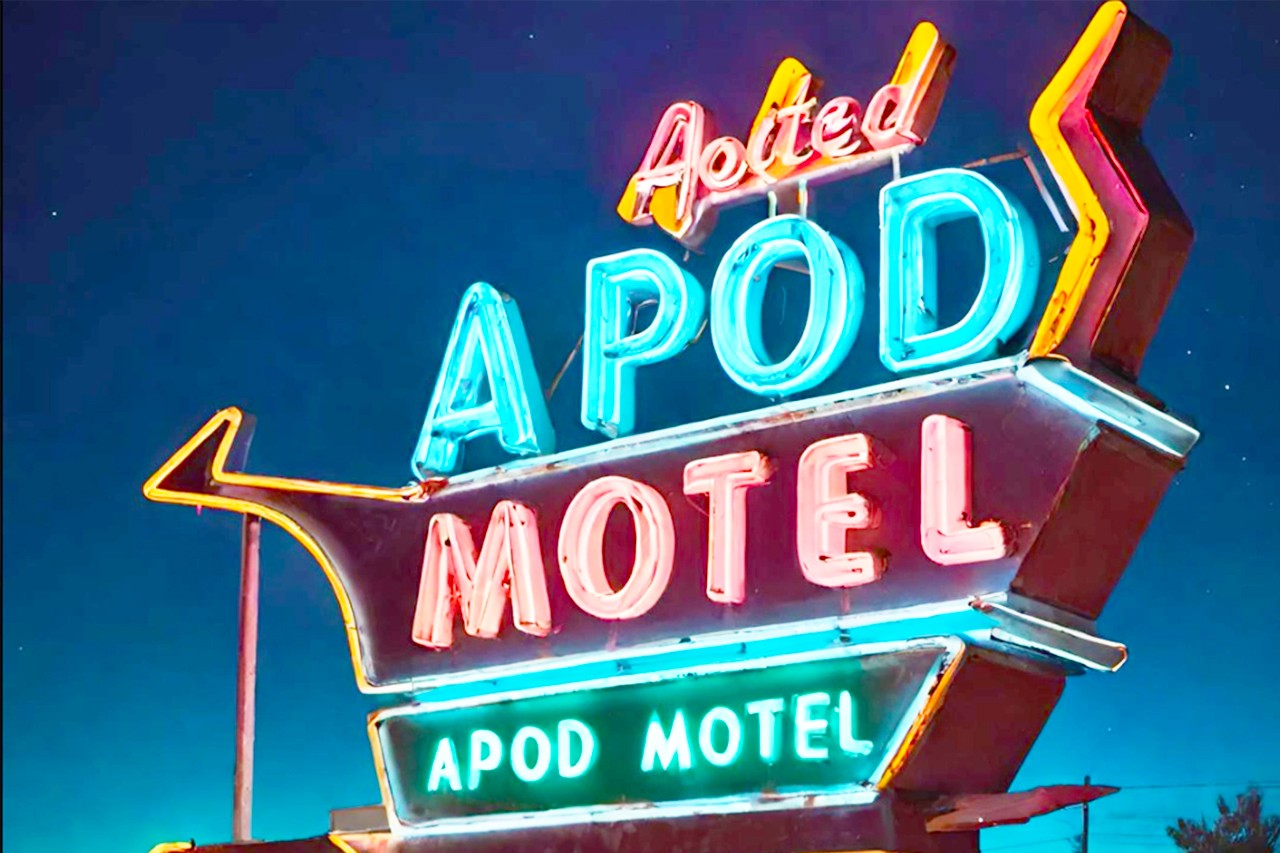 an AI generated image of a neon hotel sign with the words APOD MOTEL