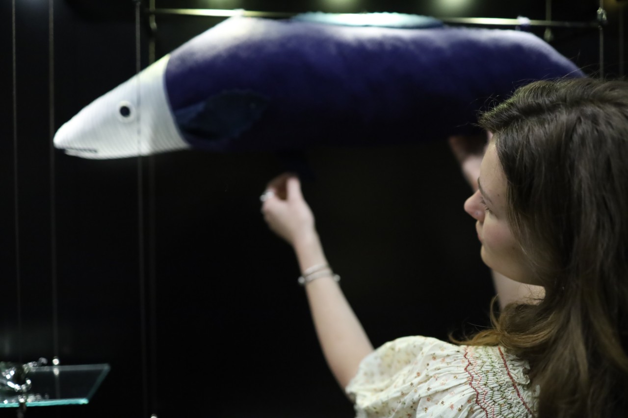 An artist installing her fabric work