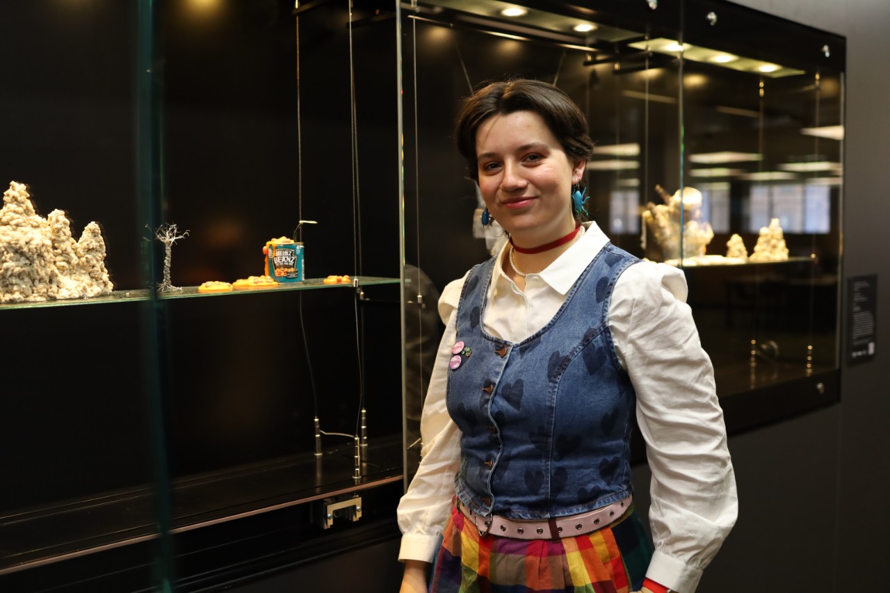 Bee Walker installing their artwork