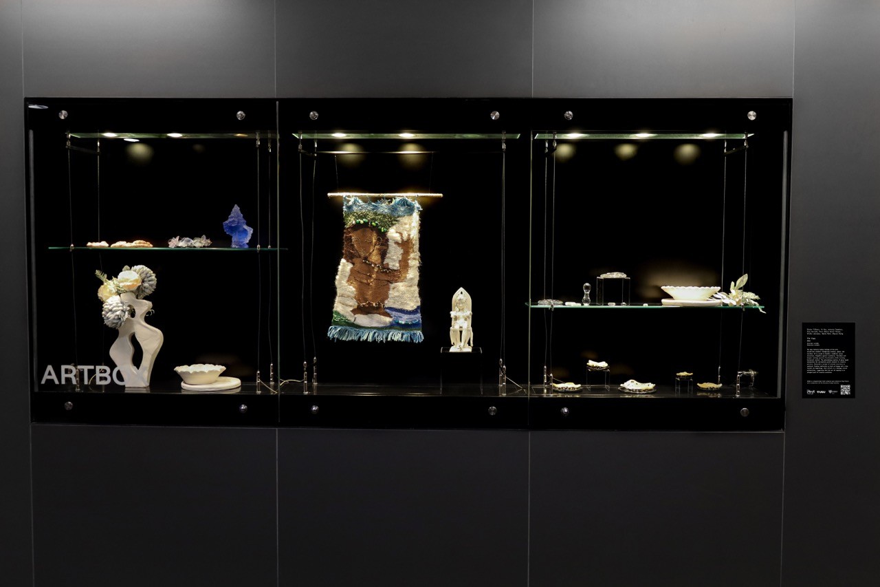 Wide shot of the ARTBOX display case featuring a variety of artworks