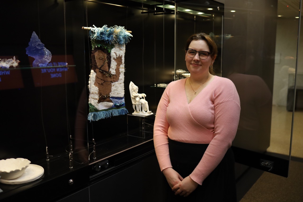 Wren Thomas standing next to ARTBOX installation