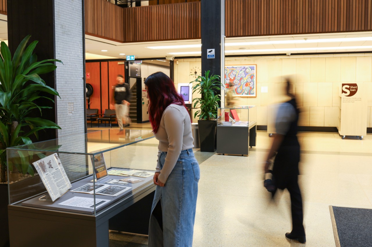 Display cabinets in Fisher Library foyer