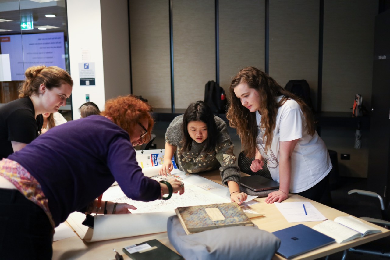 Students in an object based learning class looking at collection material