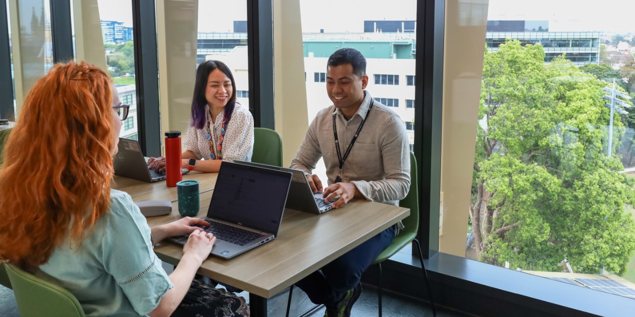 Library staff working at a table together