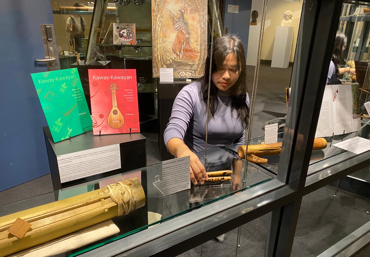 Starr Abelardo installing her exhibition at the Conservatorium Library