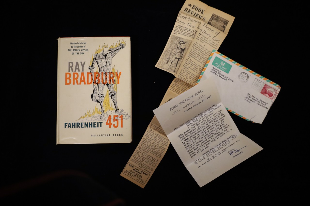 a collection of banned books on a velvet background