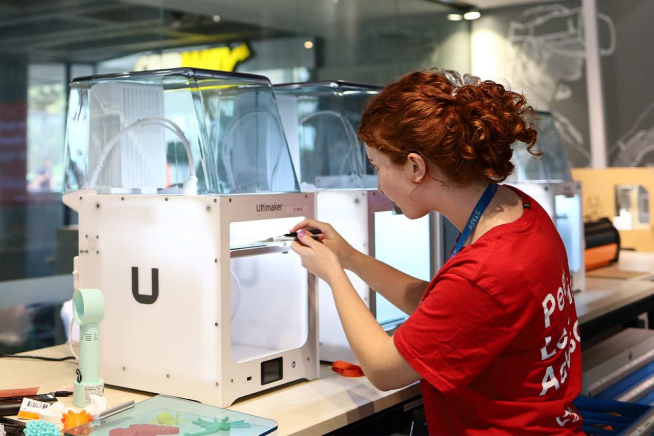 PLA staff using a 3D printer